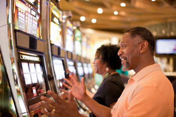 Dream Gaming mobile app interface showing live table selection and slot games
